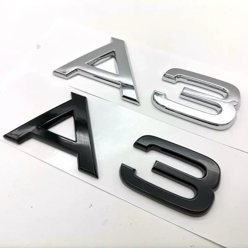 Audi model symbols in black and silver colors