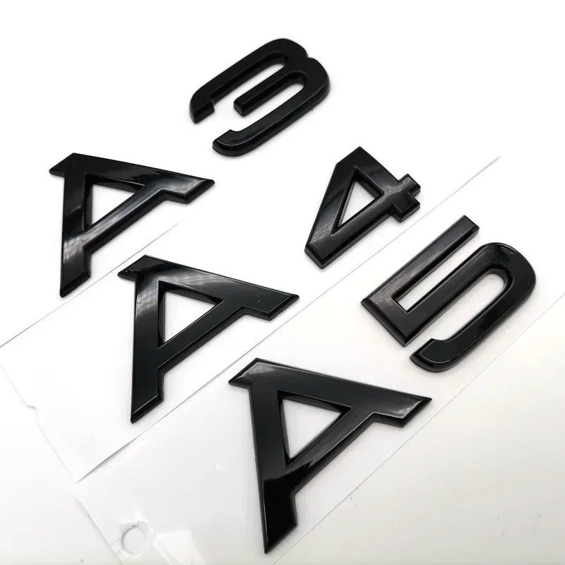 Audi model symbols in black and silver colors